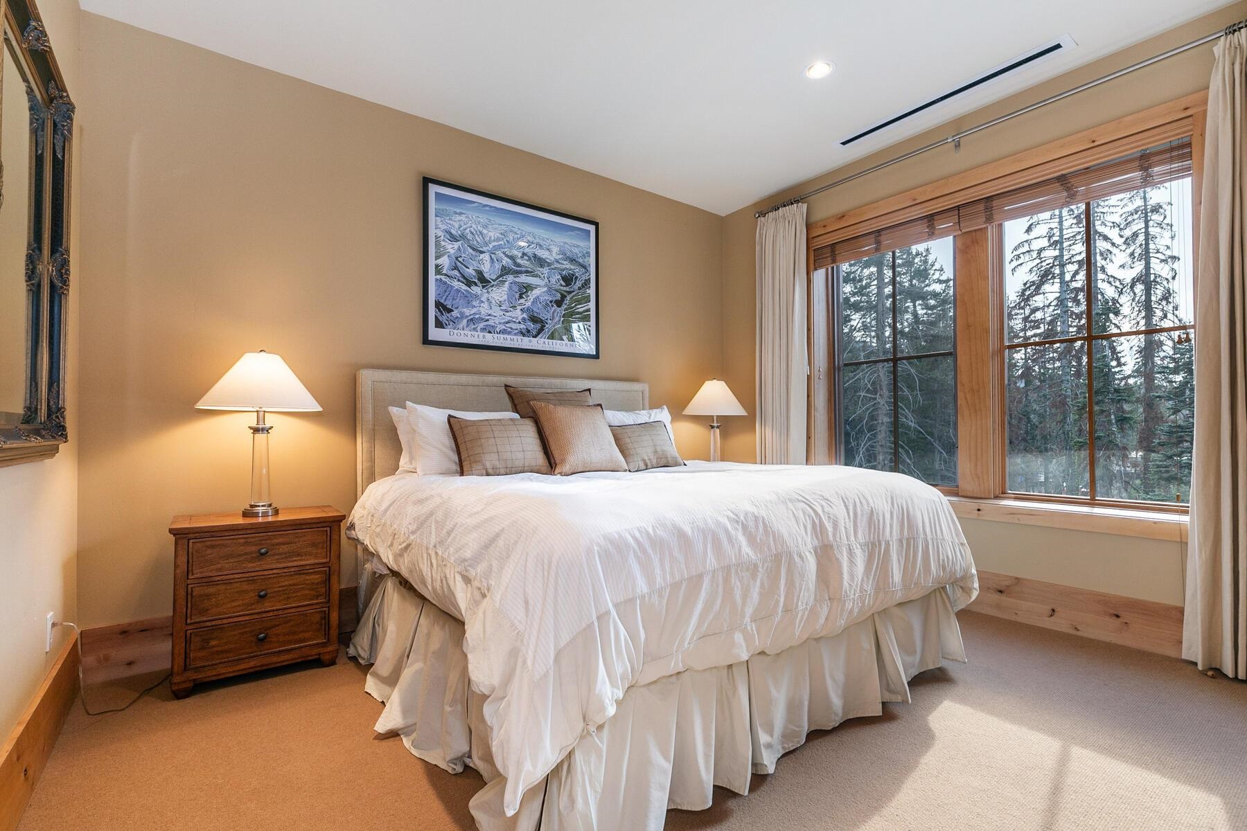 600 Sugar Bowl Road, Unit 211 Truckee, CA 96161 - Photo 6 of 21 a bedroom with a bed and a large window