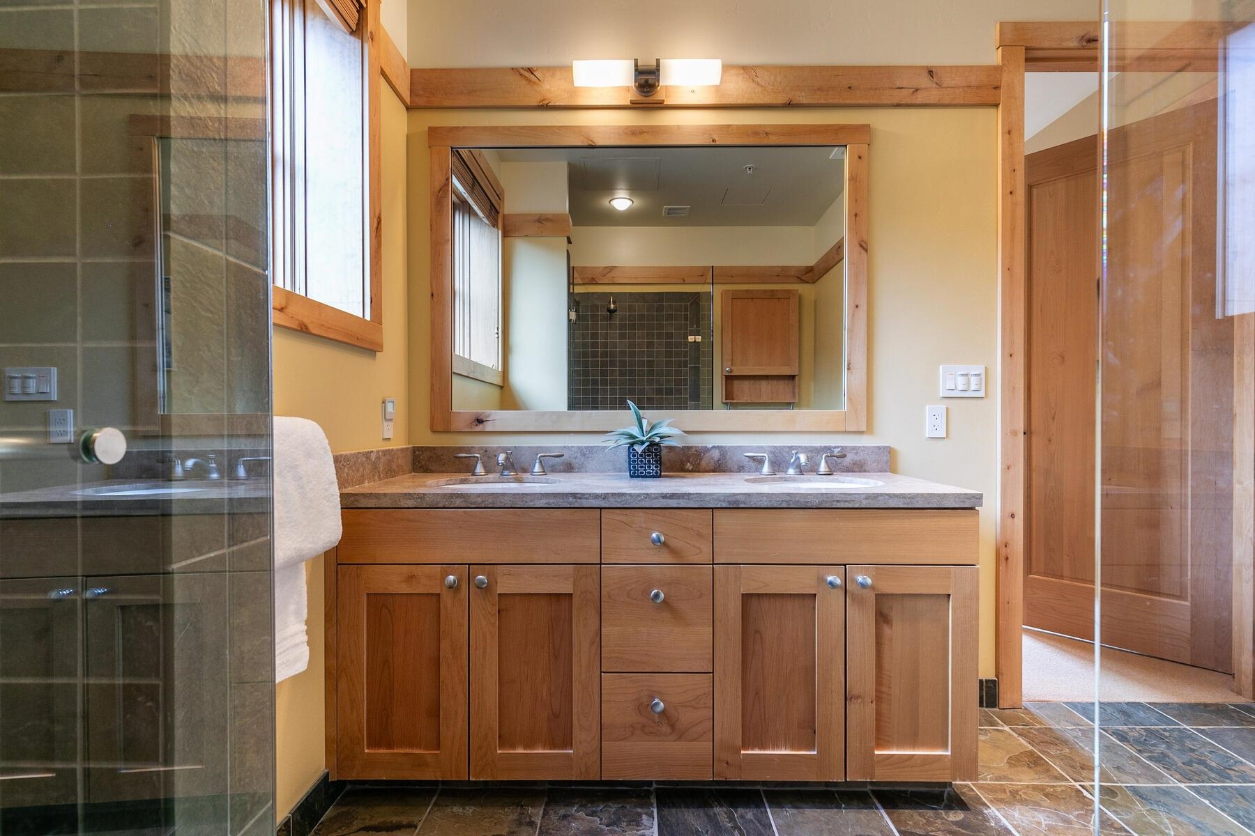 600 Sugar Bowl Road, Unit 211 Truckee, CA 96161 - Photo 9 of 21 a bathroom with a granite countertop sink a vanity and a large mirror