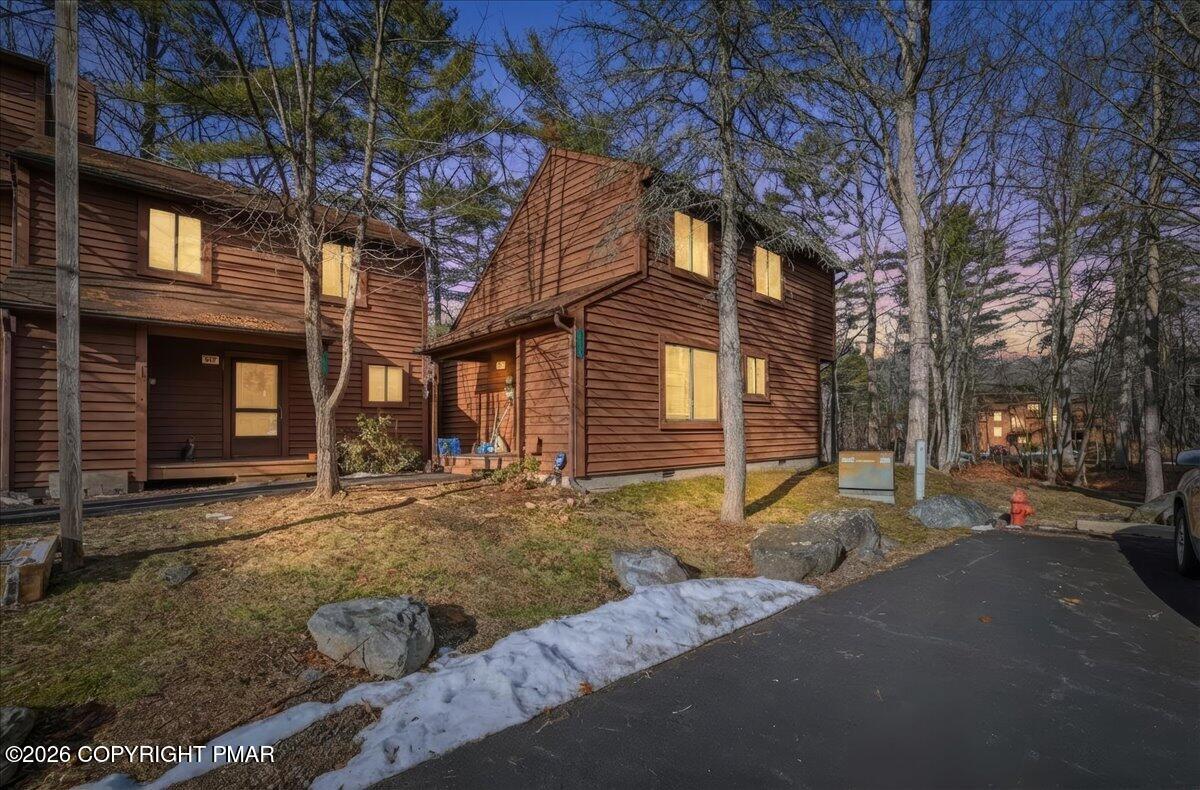 a view of a house with a yard