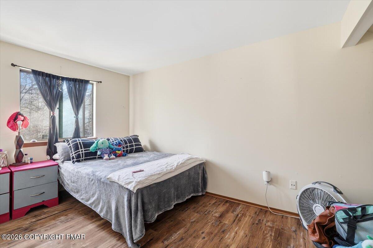 518 Wales Court Bushkill, PA 18324 - Photo 12 of 18 a bed sitting in a bedroom next to a window