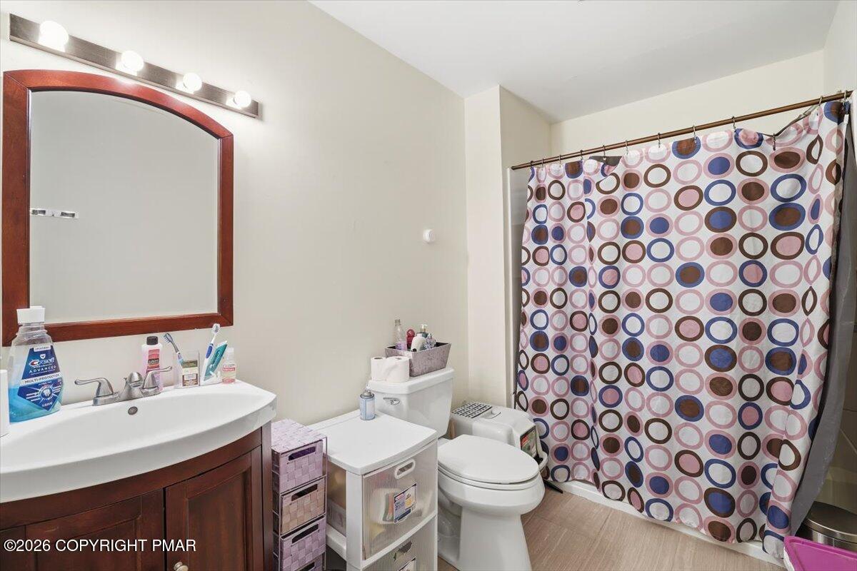 518 Wales Court Bushkill, PA 18324 - Photo 7 of 18 a bathroom with a sink and a mirror