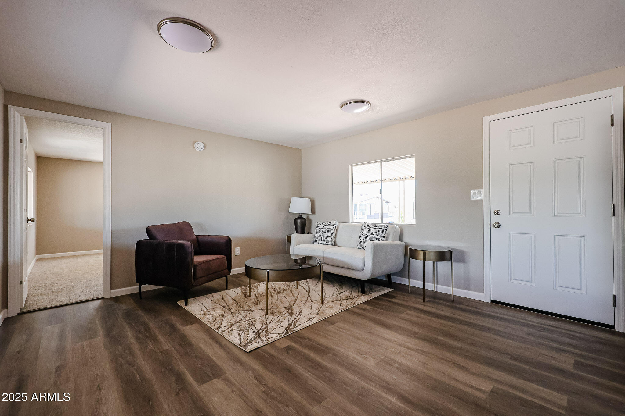 8600 East Broadway Road, Unit 53 Mesa, AZ 85208 - Photo 2 of 29 a living room with furniture and a wooden floor
