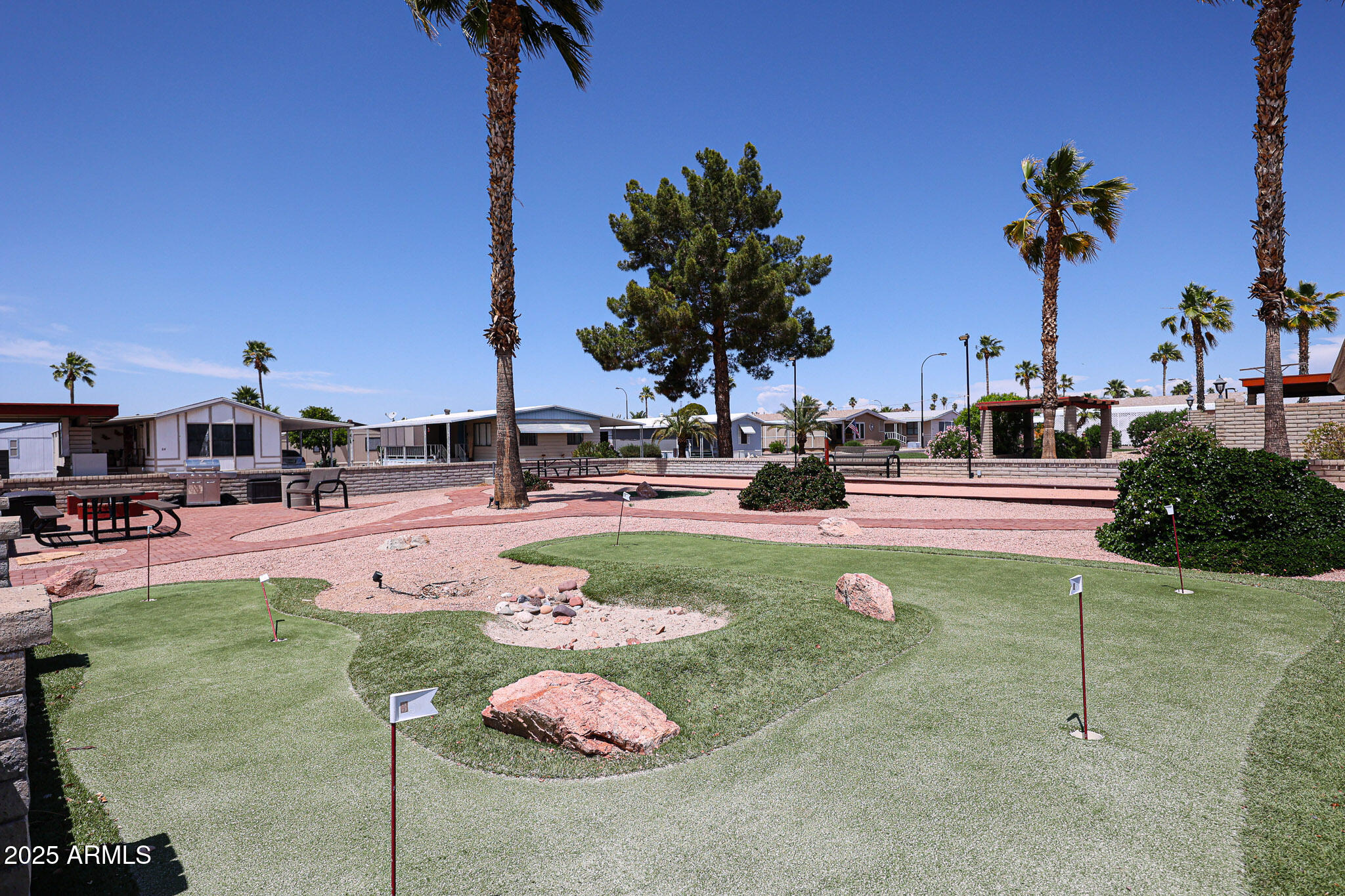8600 East Broadway Road, Unit 53 Mesa, AZ 85208 - Photo 28 of 29 a swimming pool with outdoor seating