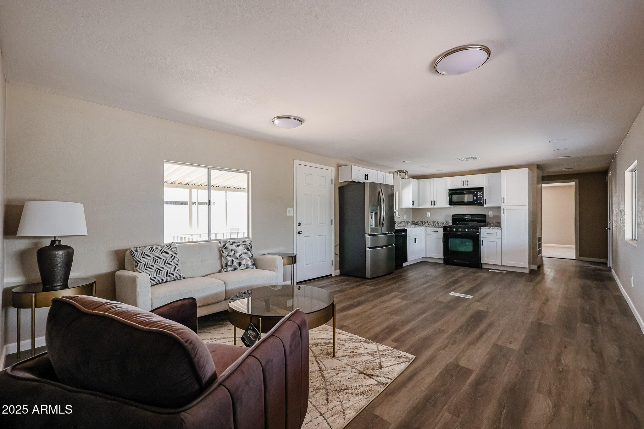 8600 East Broadway Road, Unit 53 Mesa, AZ 85208 - Photo 3 of 29 a living room with furniture and a flat screen tv