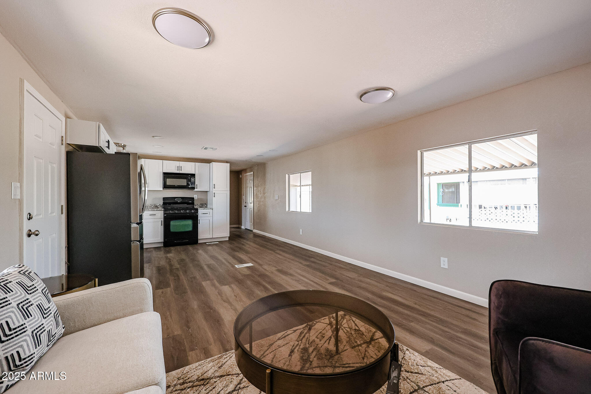 8600 East Broadway Road, Unit 53 Mesa, AZ 85208 - Photo 5 of 29 a view of a livingroom with furniture and windows