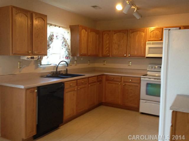 1632 Rustic Arch Way Huntersville, NC 28078 - Photo 2 of 16 a kitchen with a sink cabinets and window