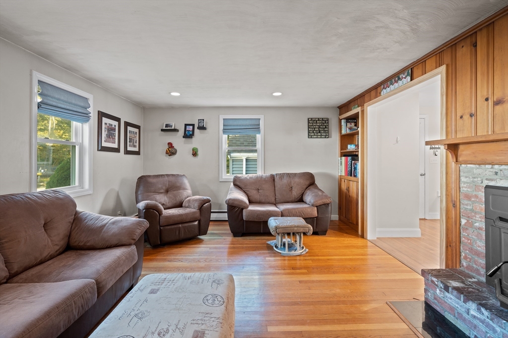 2 Woodbrier Road Topsfield, MA 01983 - Photo 11 of 29 a living room with furniture and a flat screen tv