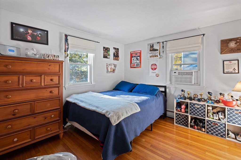 2 Woodbrier Road Topsfield, MA 01983 - Photo 12 of 29 a bedroom with a bed and wooden floor