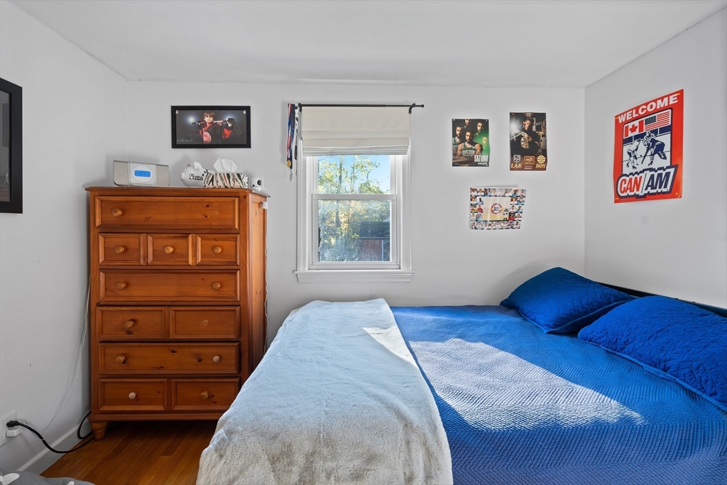 2 Woodbrier Road Topsfield, MA 01983 - Photo 13 of 29 a bedroom with a bed and a window