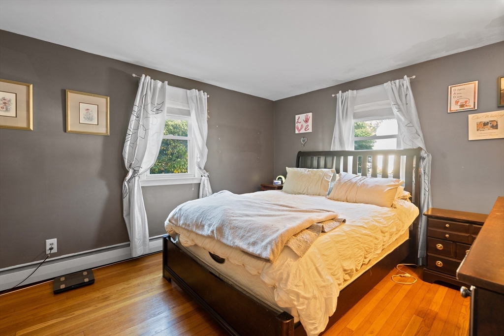 2 Woodbrier Road Topsfield, MA 01983 - Photo 14 of 29 a bed sitting in a bedroom next to a window