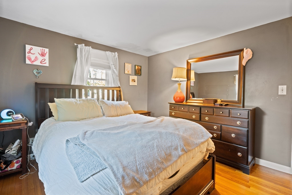 2 Woodbrier Road Topsfield, MA 01983 - Photo 15 of 29 a bedroom with a bed and a flat screen tv