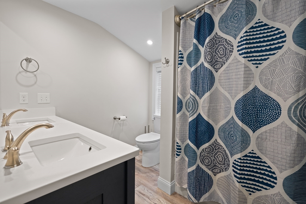 2 Woodbrier Road Topsfield, MA 01983 - Photo 16 of 29 a bathroom with a sink mirror and toilet