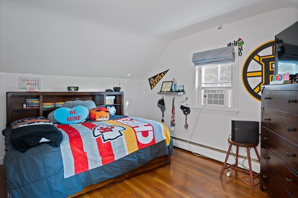 2 Woodbrier Road Topsfield, MA 01983 - Photo 20 of 29 a bedroom with a bed a dresser and window