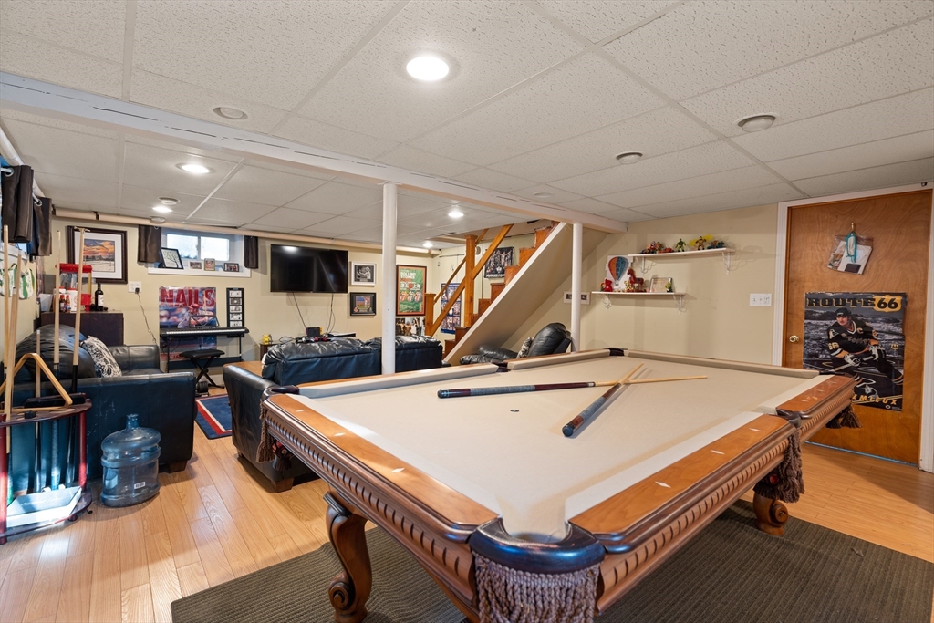2 Woodbrier Road Topsfield, MA 01983 - Photo 24 of 29 a room with furniture and a flat screen tv