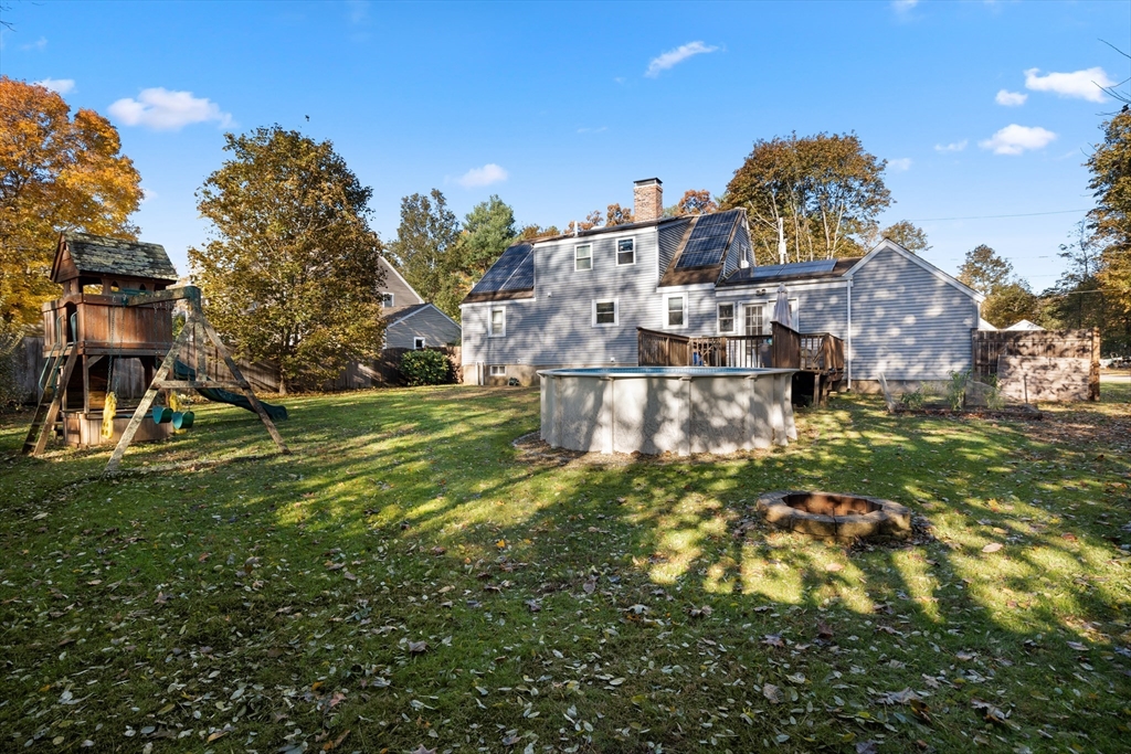 2 Woodbrier Road Topsfield, MA 01983 - Photo 27 of 29 a view of a big yard with a building in the background