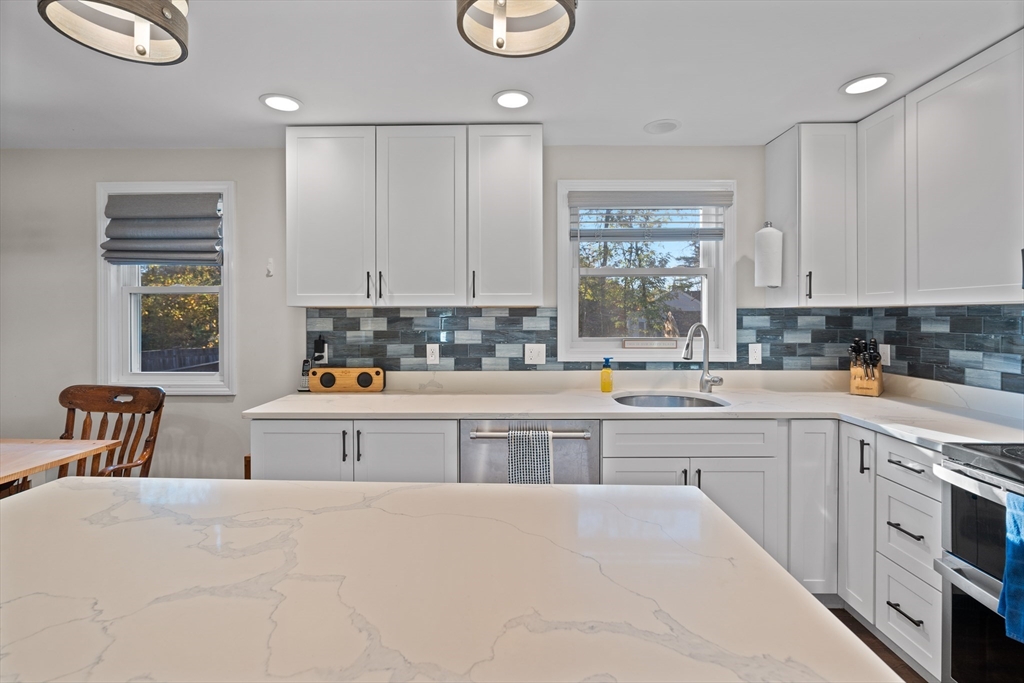 2 Woodbrier Road Topsfield, MA 01983 - Photo 5 of 29 a kitchen with stainless steel appliances granite countertop a sink cabinets and window