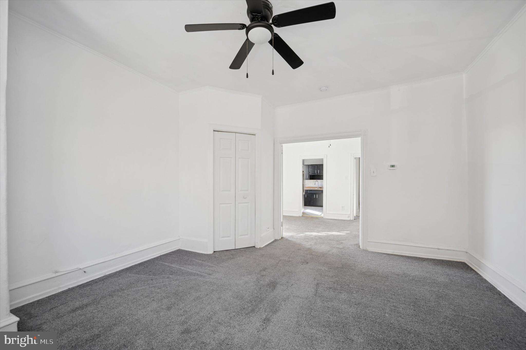 5262 Parkside Avenue Philadelphia, PA 19131 - Photo 14 of 14 en empty room with closet and chandelier fan