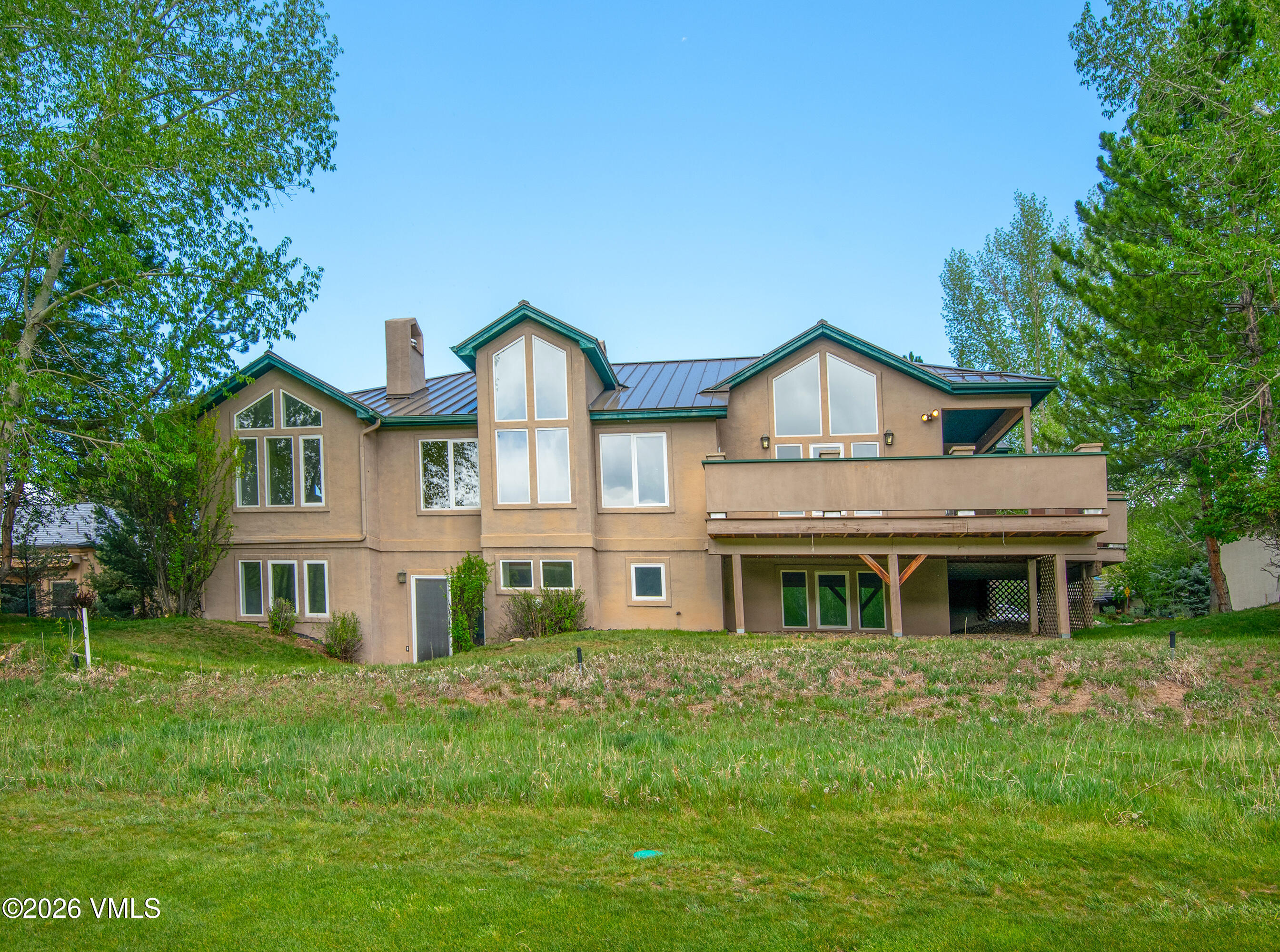 471 Rawhide Road Edwards, CO 81632 - Photo 1 of 51 a front view of a house with a garden