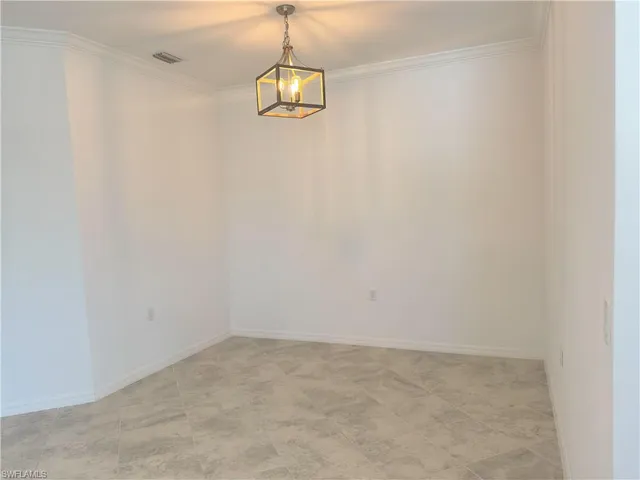 an empty room with a bathroom