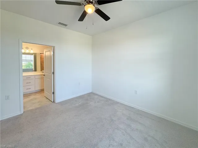 a bathroom with a granite countertop sink a shower and a mirror