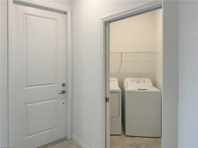 an empty room with sliding door and mountain view