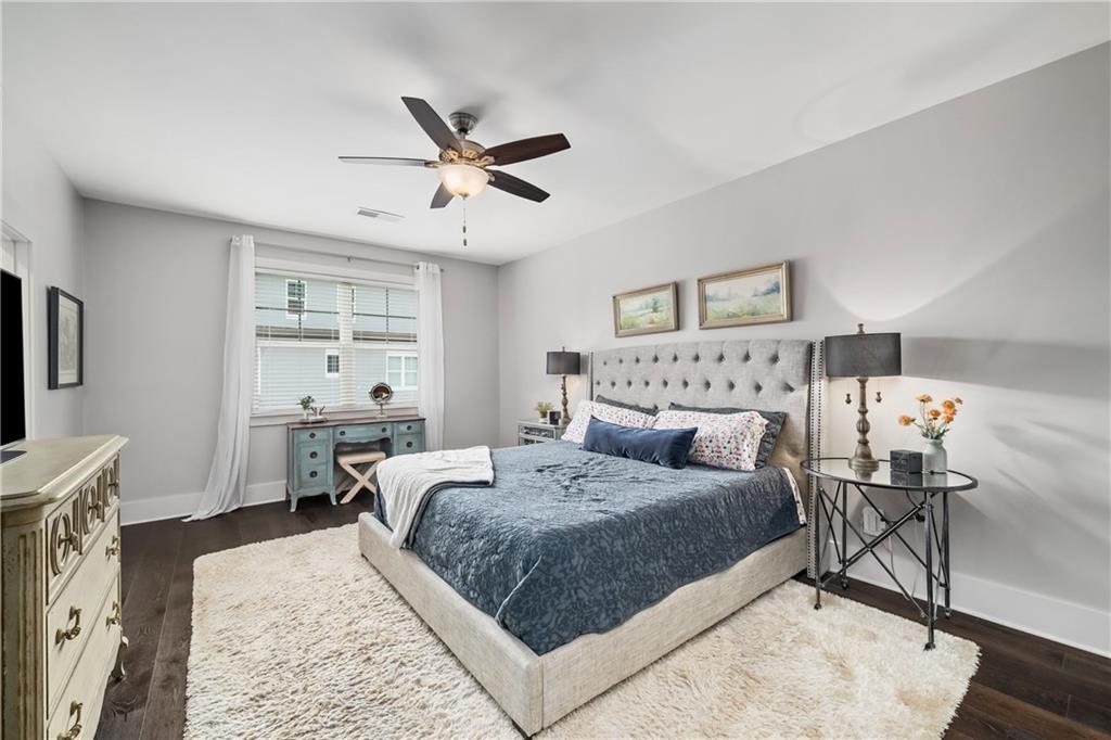108 Canton Way Roswell, GA 30075 - Photo 17 of 46 a bedroom with a large bed and a flat screen tv