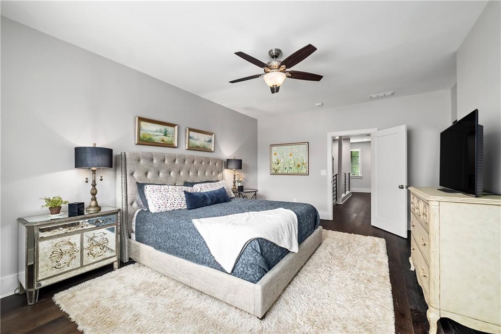 108 Canton Way Roswell, GA 30075 - Photo 19 of 46 a bedroom with a large bed and a flat screen tv