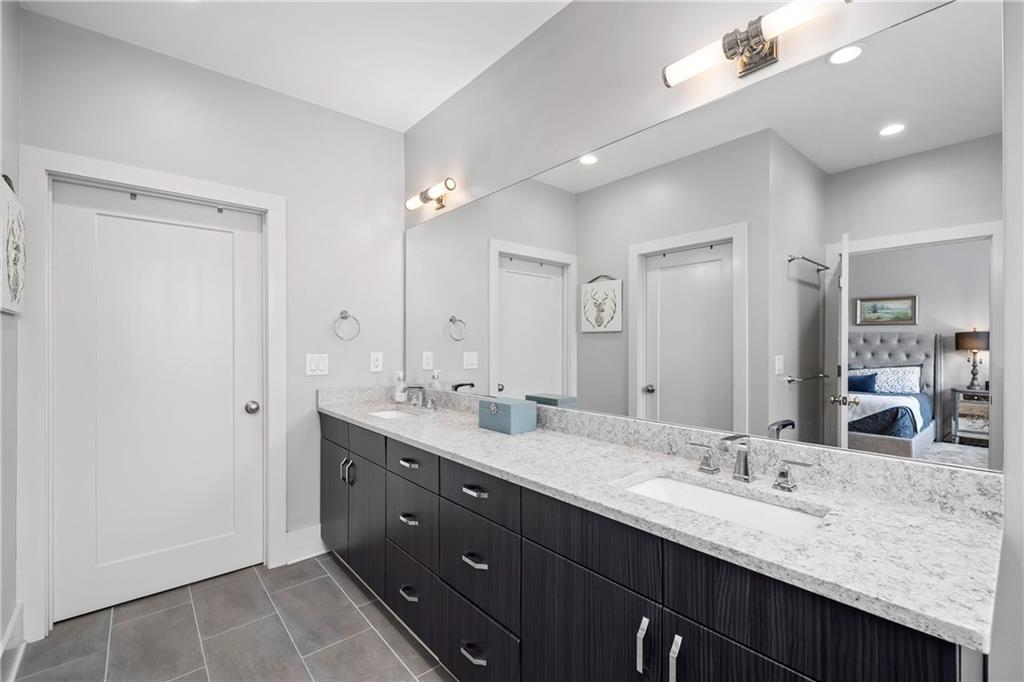 108 Canton Way Roswell, GA 30075 - Photo 21 of 46 a bathroom with double vanity sinks and a large mirror