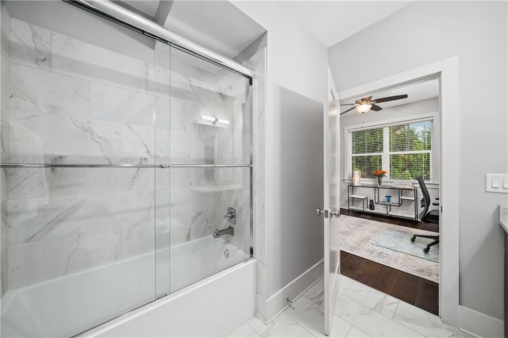 108 Canton Way Roswell, GA 30075 - Photo 27 of 46 a bathroom with a granite countertop sink a mirror and a bathtub