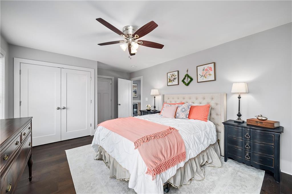 108 Canton Way Roswell, GA 30075 - Photo 32 of 46 a bedroom with a bed and a chandelier