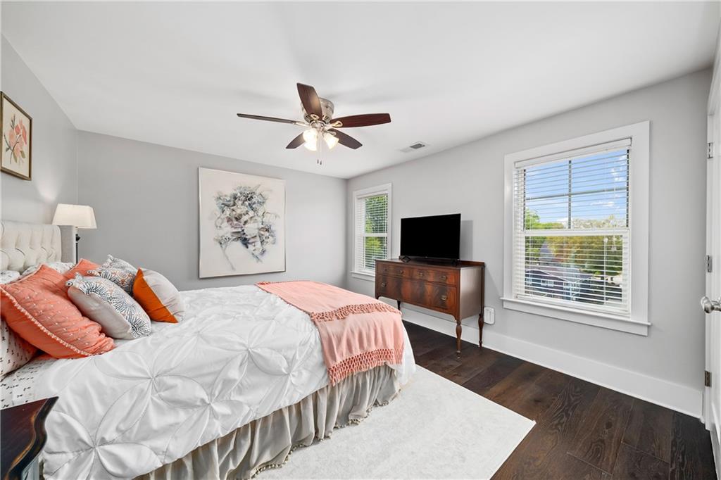 108 Canton Way Roswell, GA 30075 - Photo 33 of 46 a bedroom with a large bed a chandelier and a window