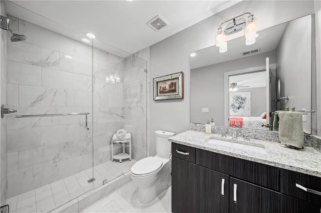 108 Canton Way Roswell, GA 30075 - Photo 34 of 46 a bathroom with a granite countertop sink a toilet and shower