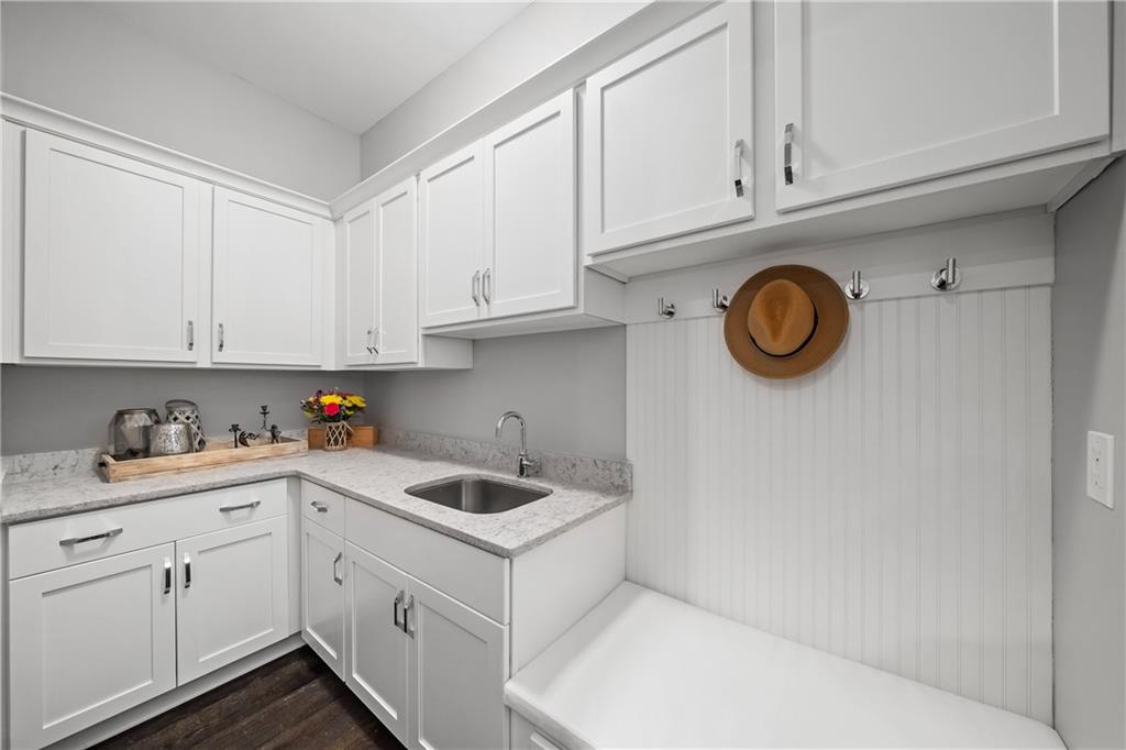 108 Canton Way Roswell, GA 30075 - Photo 37 of 46 a kitchen with cabinets and white appliances