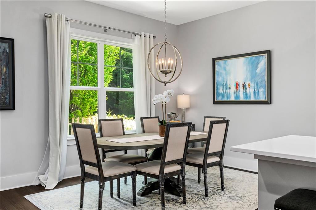 108 Canton Way Roswell, GA 30075 - Photo 6 of 46 a dining room with furniture a rug and a large window
