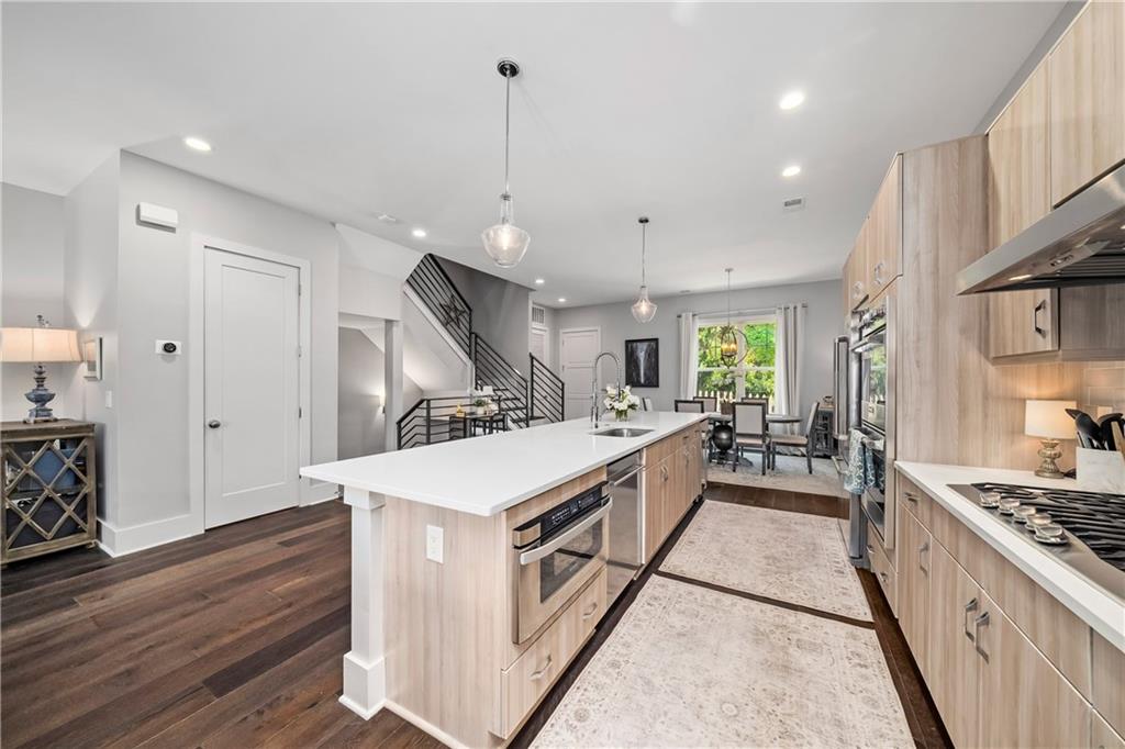 108 Canton Way Roswell, GA 30075 - Photo 10 of 46 a large kitchen with stainless steel appliances a lot of counter space