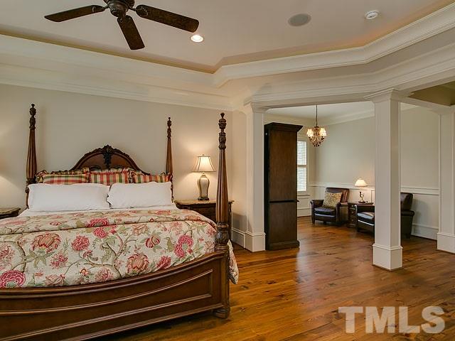 2921 Cone Manor Lane Raleigh, NC 27613 - Photo 13 of 25 a bedroom with a bed and dresser