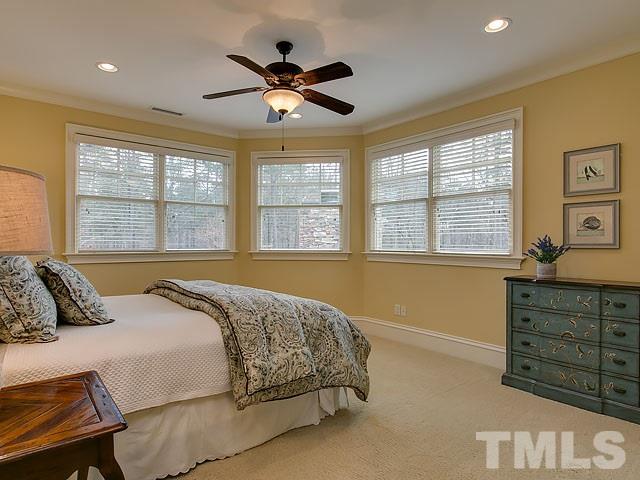 2921 Cone Manor Lane Raleigh, NC 27613 - Photo 18 of 25 a bedroom with a large bed and a window