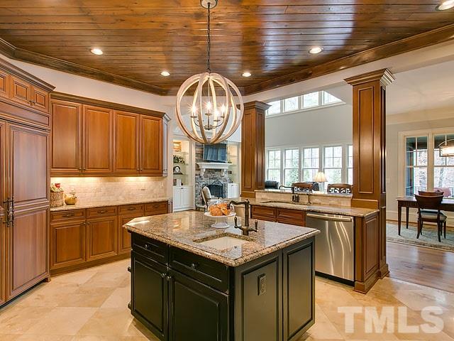 2921 Cone Manor Lane Raleigh, NC 27613 - Photo 6 of 25 a kitchen with stainless steel appliances granite countertop a sink and a stove