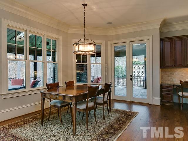 2921 Cone Manor Lane Raleigh, NC 27613 - Photo 8 of 25 a view of a dining room with furniture window and wooden floor