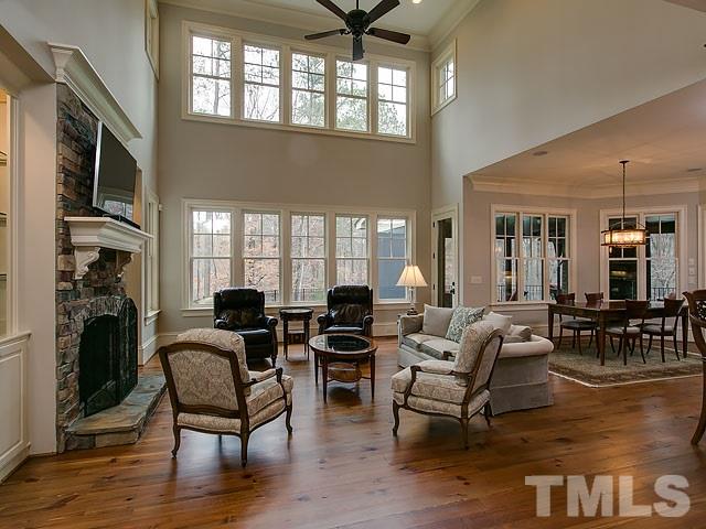 2921 Cone Manor Lane Raleigh, NC 27613 - Photo 9 of 25 a living room with fireplace furniture and a large window