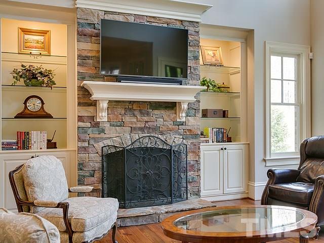 2921 Cone Manor Lane Raleigh, NC 27613 - Photo 10 of 25 a living room with furniture and a fireplace
