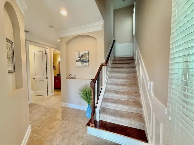a kitchen with granite countertop cabinets stainless steel appliances and wooden floor