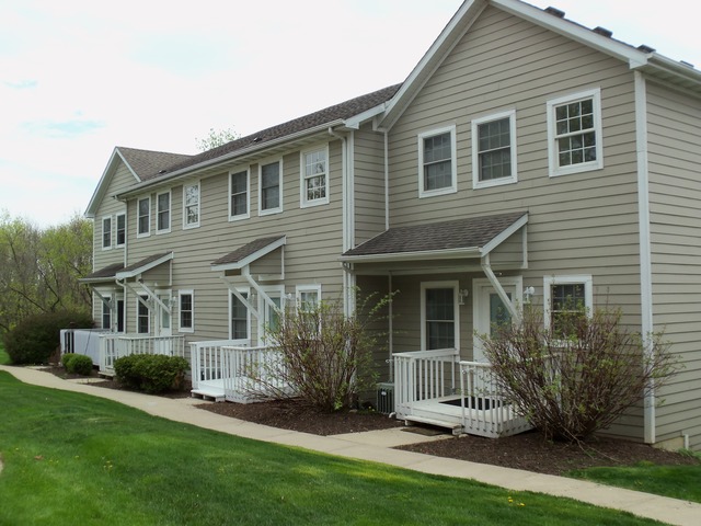 2031 Lisbon Road, Unit B Morris, IL 60450 - Photo 1 of 21 a front view of a house with a yard