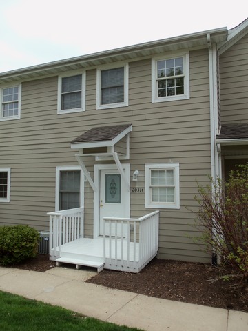 2031 Lisbon Road, Unit B Morris, IL 60450 - Photo 2 of 21 a view of a house with a yard