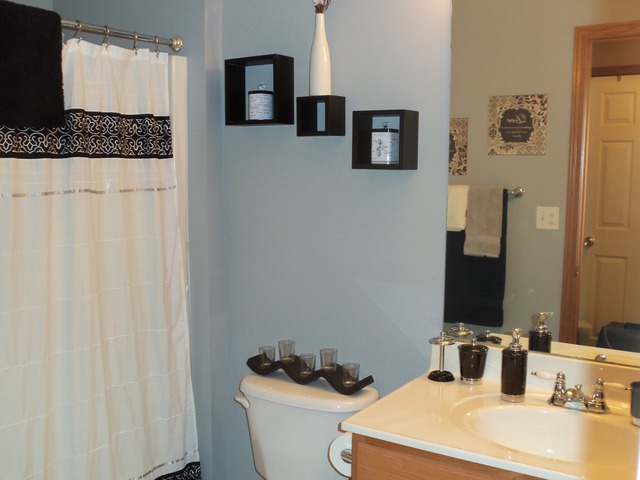 2031 Lisbon Road, Unit B Morris, IL 60450 - Photo 14 of 21 a bathroom with a granite countertop sink and a mirror