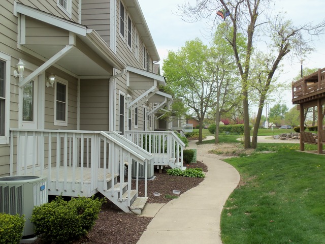 2031 Lisbon Road, Unit B Morris, IL 60450 - Photo 3 of 21 a view of a house with a yard deck and a small yard