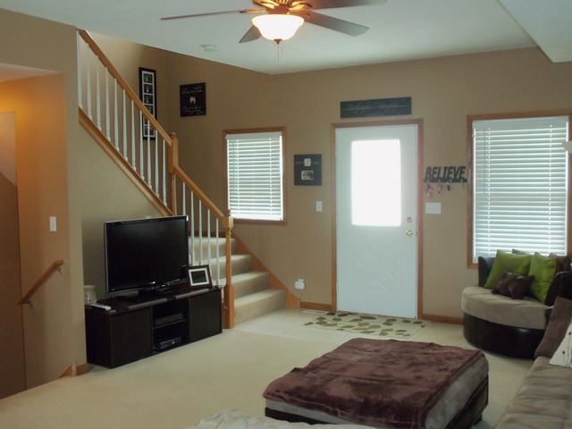 2031 Lisbon Road, Unit B Morris, IL 60450 - Photo 4 of 21 a living room with furniture and a flat screen tv