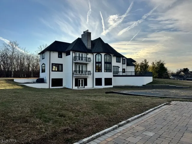 a view of a big house with a yard