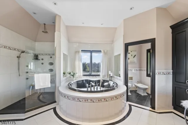 a room that has a toilet and bathtub in it