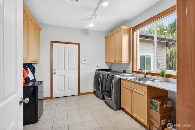 a view of hallway with walk in closet and wooden floor